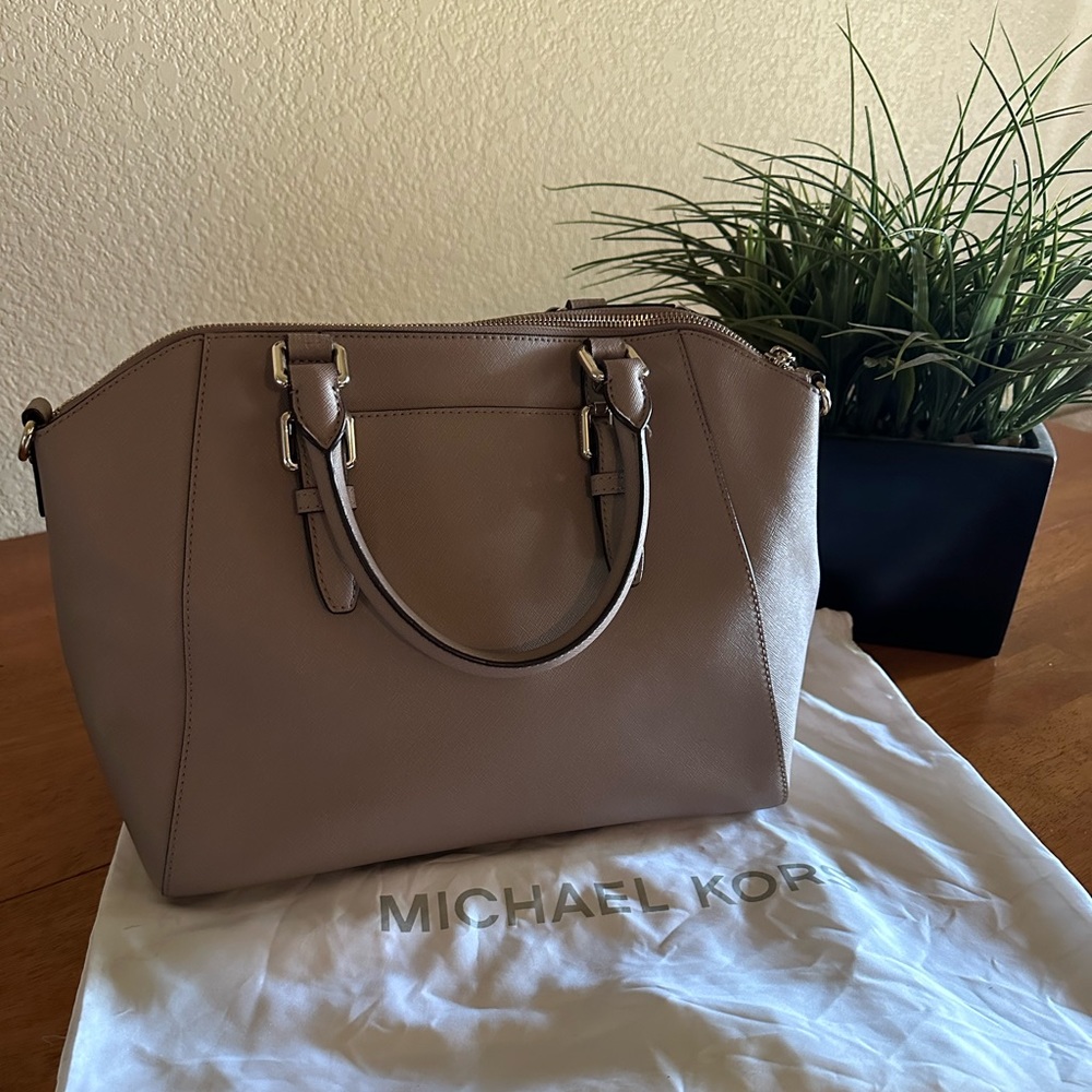 Michael Kors. Gorgeous; tags attached. Truffel color.  Comes with dust bag.